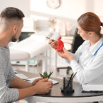 gastroenterologist and patient during diagnosis